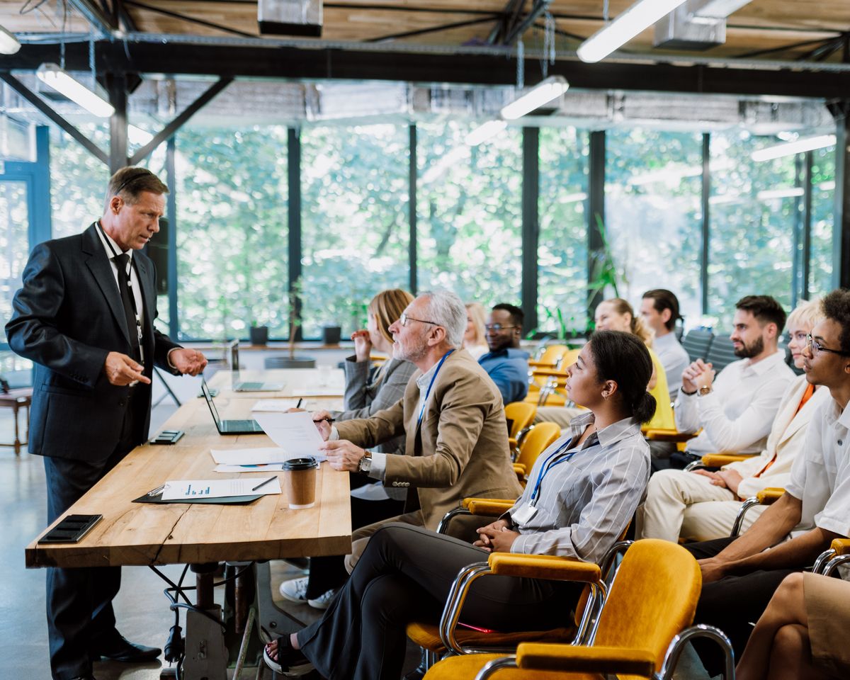 A team in a workshop, working through an exercise with a facilitator